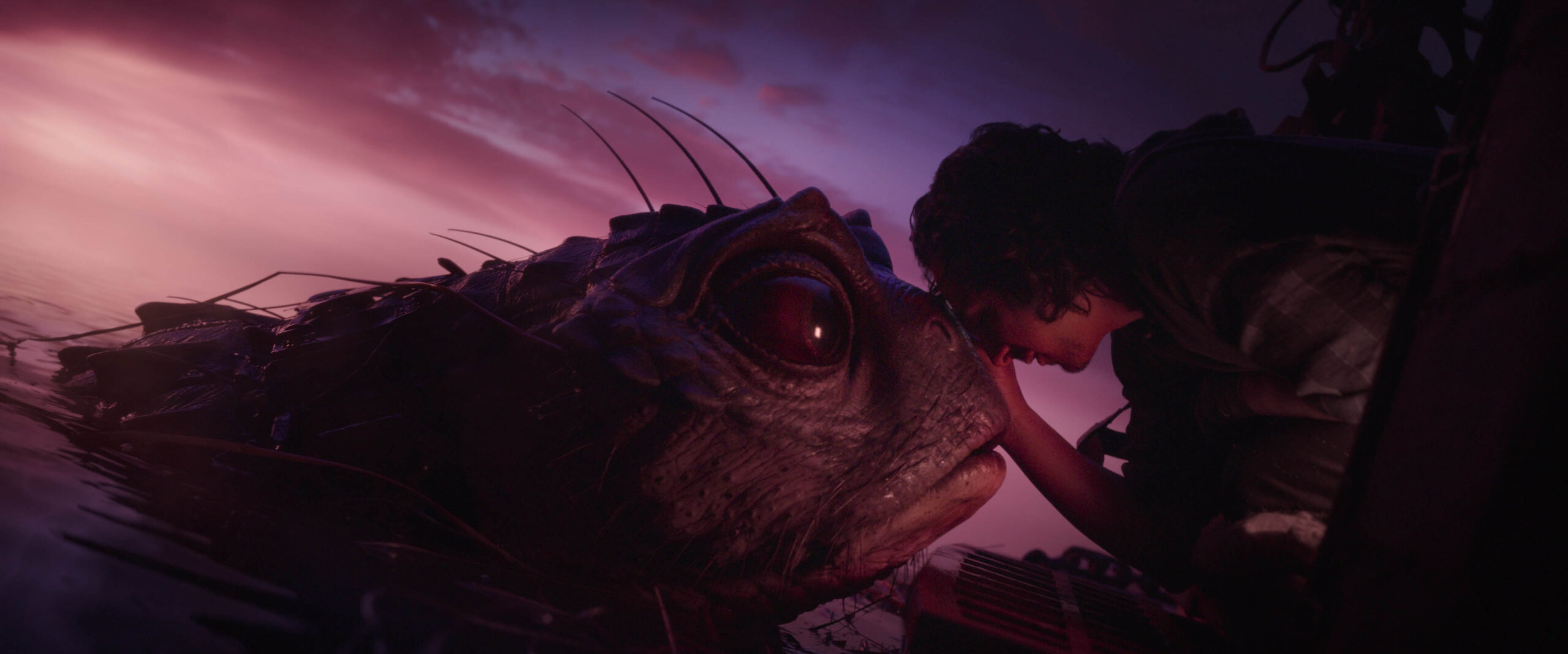 (S-D): A mudmander and Graydon (Tony Revolori) in in Willow [credit: Lucasfilm; Copyright 2022 Lucasfilm Ltd. and TM. All Rights Reserved; courtesy of Disney]