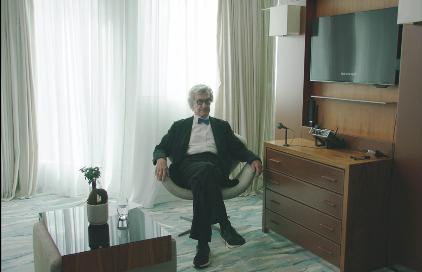 Wim Wenders in Room 999 [tag: Wim Wenders] [credit: MK Productions; courtesy of CG Entertainment]